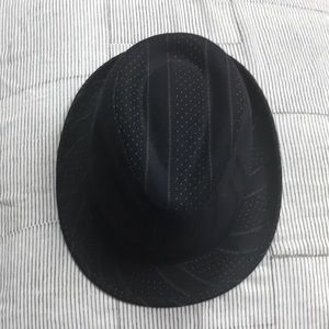 Black Fedora style hat with stitching detail.